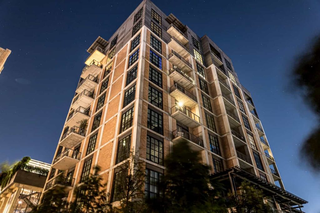 A condominium building photographed at night.