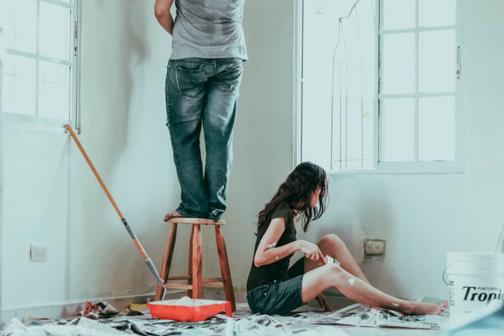 A young couple painting their Beaverton condo