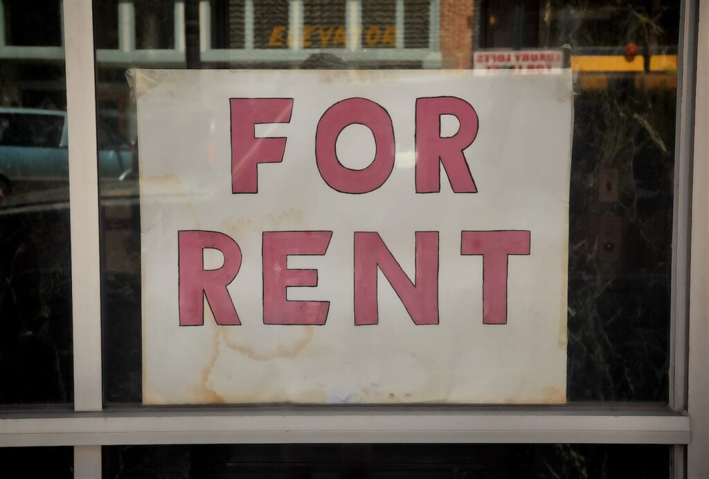 A For Rent sign posted in a window landlord responsibilities