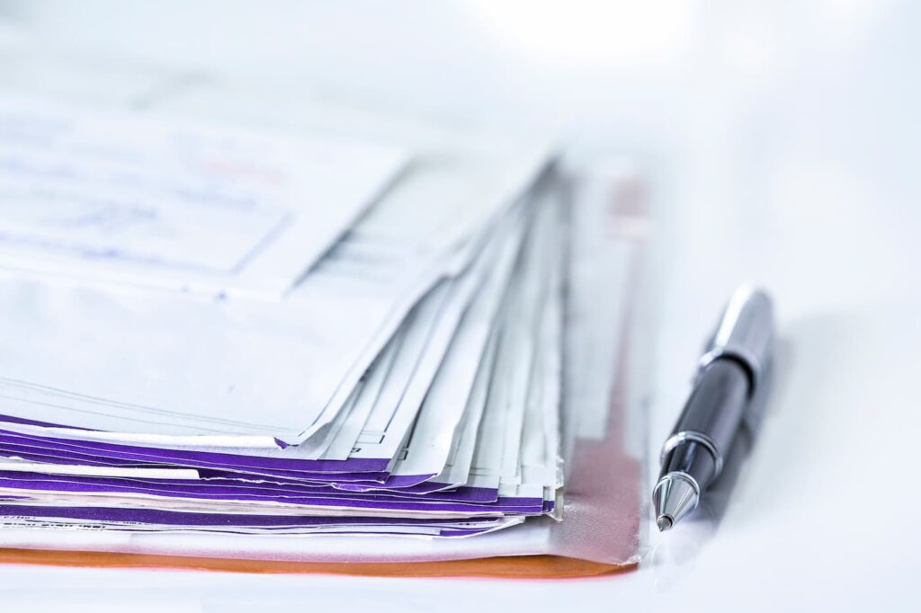 A pile of tenant screening paperwork for rentals in Portland.