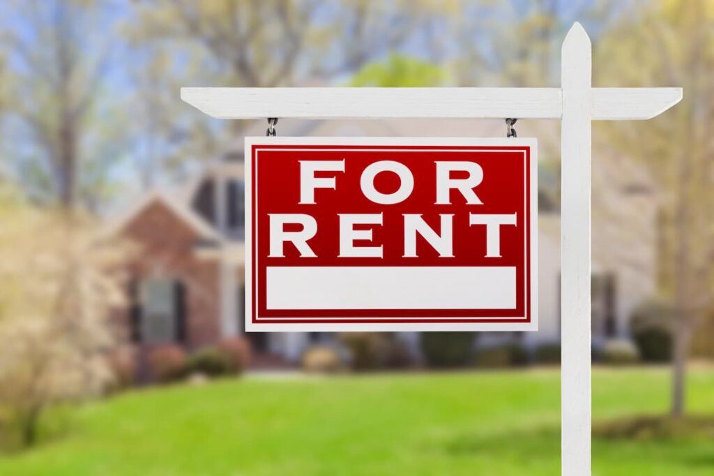 A for rent sign sits on a lawn as a result of tenant turnover.