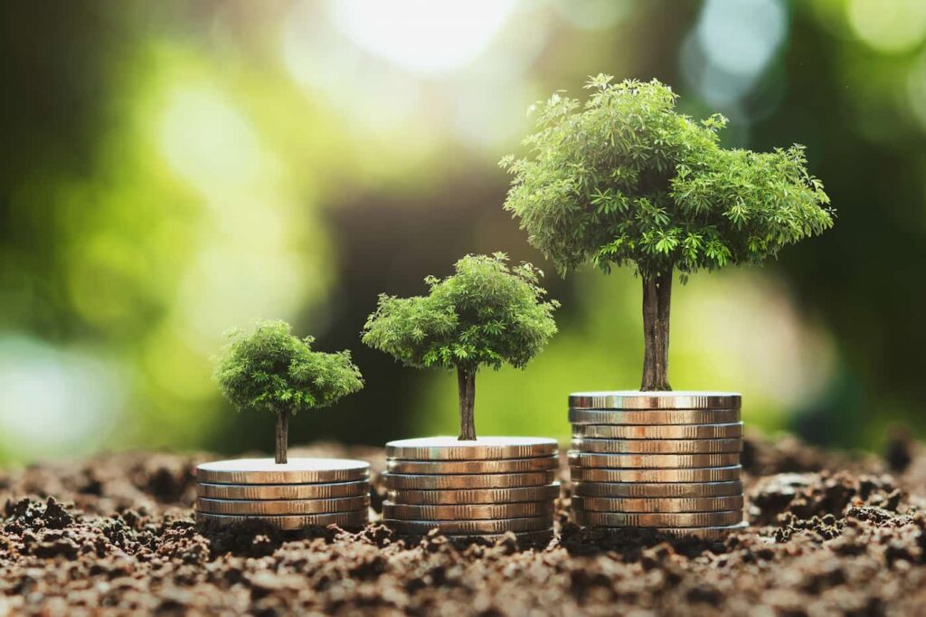 a graphic of trees growing from three sticks of gold coins, which illustrates the benefits of considering longevity in your investment strategy